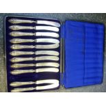 Silver cased lot of eleven silver handled knives very worn, hallmarked Sheffield 1916, George