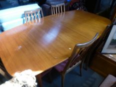 Mid Century teak extending table and set 6 teak barback dining chairs upholstered in pink fabric