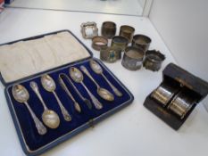 Pair of late Victorian silver napkin rings, cased together with a collection of various other napkin