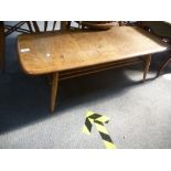 An Ercol light elm oblong coffee table, 104cms