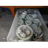 Crate of mainly Green Wedgwood embossed Queensware and German teacups