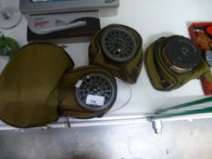 A small selection of fly fishing reels, one by Young & Son Ltd, in bags with accessories