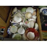 Boxes of china to include teacups and saucers of mied patterns