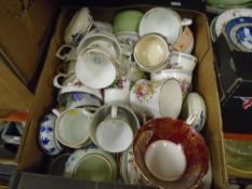 Boxes of china to include teacups and saucers of mied patterns