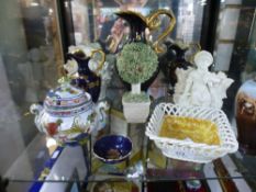 A quantity of china ornaments, to include blue and gold Limoges jugs, etc