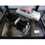 A metal Citroen 15CV scale 1:18 by Maisto and an American pink and white car