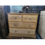 Stripped pine chest of 2 short drawrs over 2 long drawers