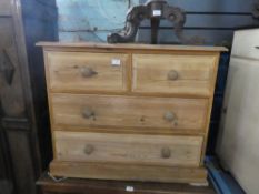 Stripped pine chest of 2 short drawrs over 2 long drawers