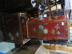 Two modern Chinese red lacqured cabinets decorated with birds and flowers