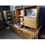 Mid century teak wall unit with glazed bookcase, open bookcase and drop down desk above drawers