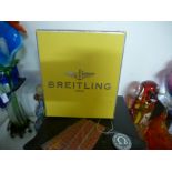 An original BREITLING watch box and an OMEGA James Bond Quantum of Solace watch box & wallet