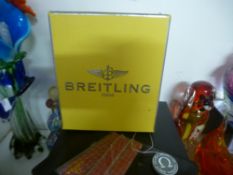 An original BREITLING watch box and an OMEGA James Bond Quantum of Solace watch box & wallet