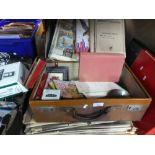A vintage case containing books, bone counters from Hamleys, Meloday Maker magazines, etc