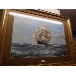 A large gilt frame picture of a sailing ship, signed M Dawson