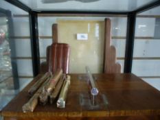 An Art Deco walnut veneered cigar box, along with a wood Deco standing photo frame