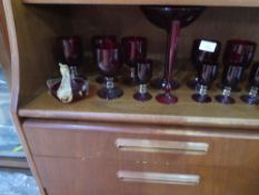 Quantity red glass vases, jugs, wine glasses, etc