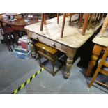 Stripped pine rectangular kitchen table with a drawer on turned supports