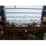 A quantity of cut glass items to include a bon bon dish, vases, decanter and four brass ornaments