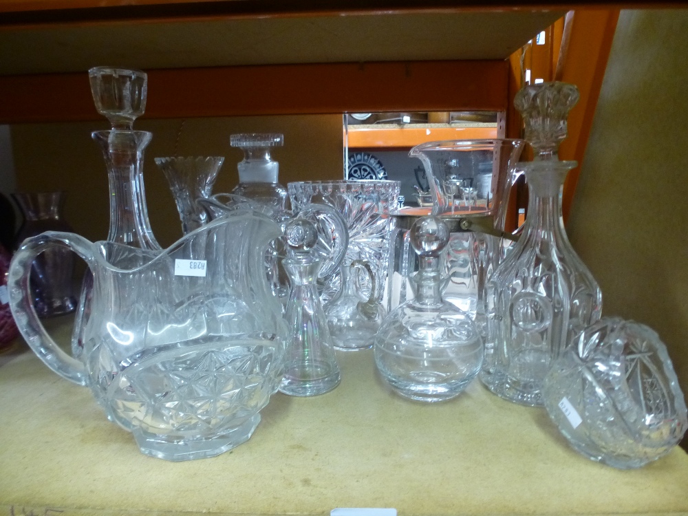 A selection of white cut glass including water jugs and decanters
