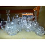 A selection of white cut glass including water jugs and decanters