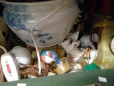 A box of mixed china figures, animals, birds, dogs and mantle clocks, lamp and chamber pot