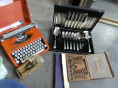 A cased Hermes baby typewriter, canteen of cutlery, dye set etc