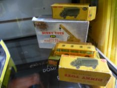 Two boxed Dinky army trucks, plus a bus and mobile crane