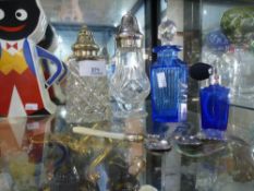 A selection of cut glass bottles of which two are blue perfume bottles and a small quantity of