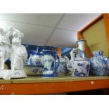 A selectin of blue and white china, some with markings to the bottom and a white dancing figure