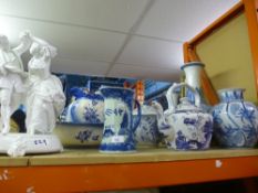 A selectin of blue and white china, some with markings to the bottom and a white dancing figure