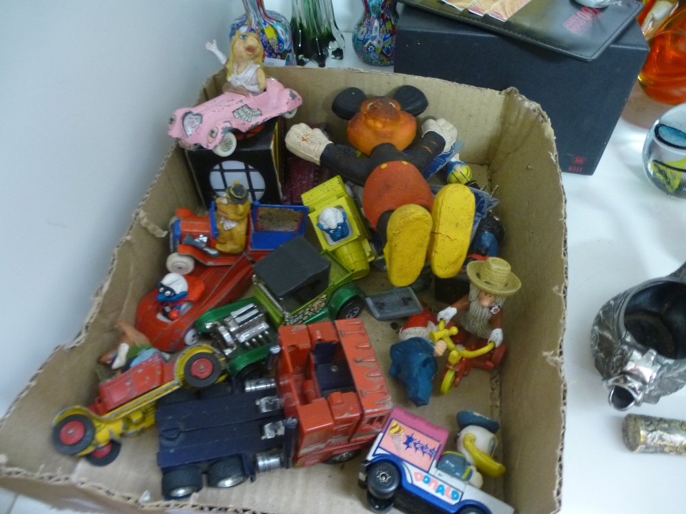 A selection of TV related model cars, transformers, Magic Roundabout, Smurfs, etc