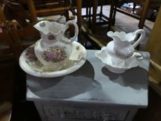 Two floral decorated ewer and basins