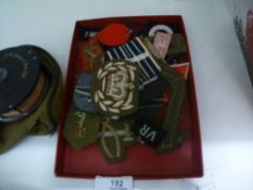 A selection of military cloth badges, of various Regiments and ages