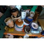 A quantity of Breweryana to include water jug, ashtrays, and Royal Doulton toby jugs