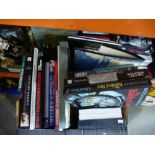 A box of military books and DVDs