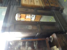 Vintage oak wardrobe with central mirrored door above base drawer