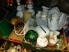 A box containing mostly Limoges dinnerware with a pair of lamps, stone pots, etc