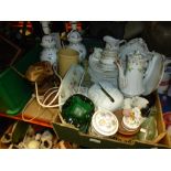 A box containing mostly Limoges dinnerware with a pair of lamps, stone pots, etc