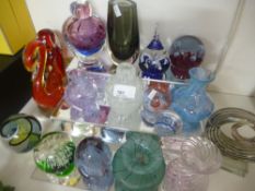 A selection of paper weights, some stamped Caithness