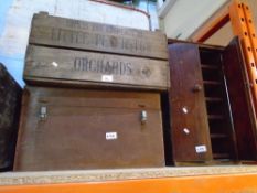 Advertising crates and a vintage cabinet with sliding shelves