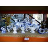 A quantity of blue and white ornaments to include Delft egg cups, teapots in the form of