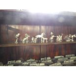 Shelf of silvered pewter model animals including horse, rabbits, birds, etc