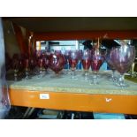 A quantity of mixed Cranberry drinking glasses to include, brandy bowls, wine glasses, champagne