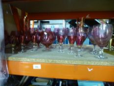 A quantity of mixed Cranberry drinking glasses to include, brandy bowls, wine glasses, champagne