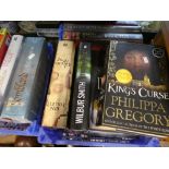 Two crates of mostly hardback books to include Ken Follett, Wilbur Smith, Bernard Cornwell