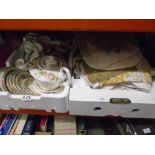 Two boxes of vintage linen to include embroidered tablecloths and a small quantity of china
