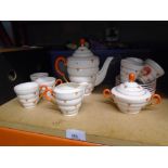 Vintage part china tea set with geometric patterns and a box of World dolls