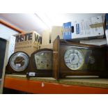 Three wooden case clocks including one made by Smiths