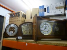 Three wooden case clocks including one made by Smiths