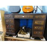 Vintage mahogany pedestal desk, with brown tooled leather above 9 drawers